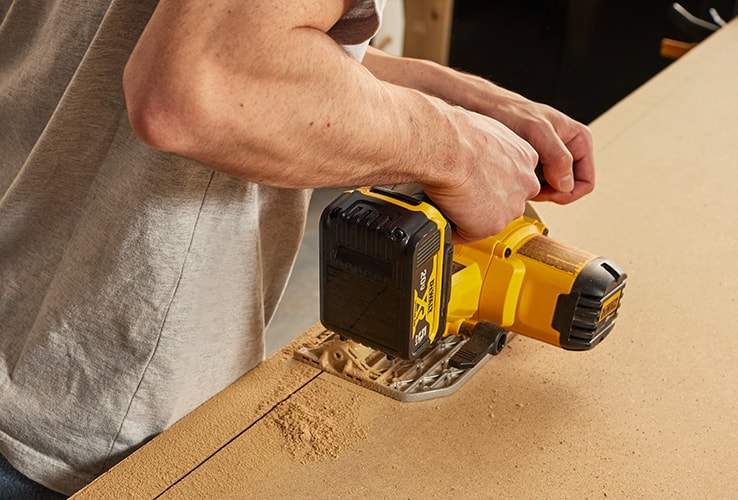 Person cutting an MDF board