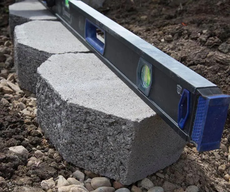 Level placed on a row of concrete blocks