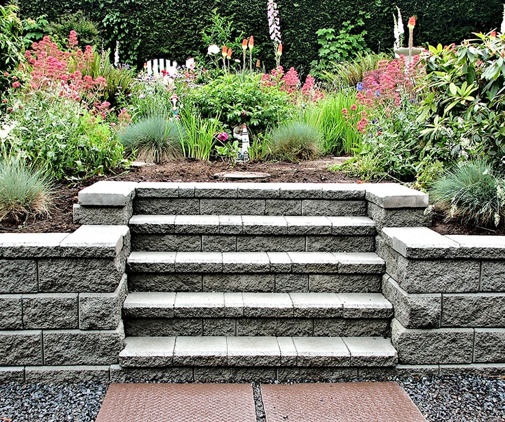 Concrete retaining wall with a raised flower bed