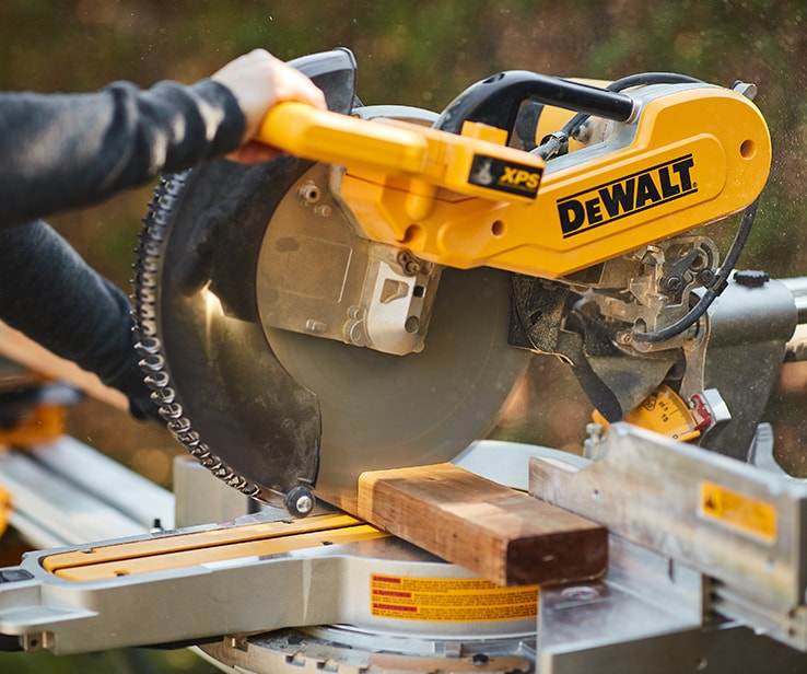 Person using a mitre saw