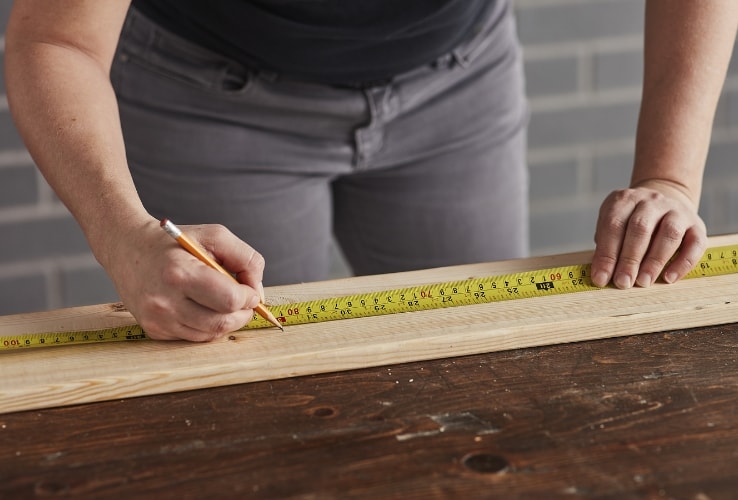 Person using a tape measure