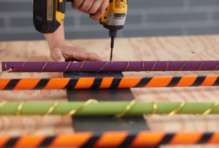 Person assembling a DIY Halloween decoration