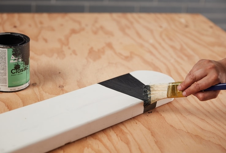 Person painting DIY Halloween decorations