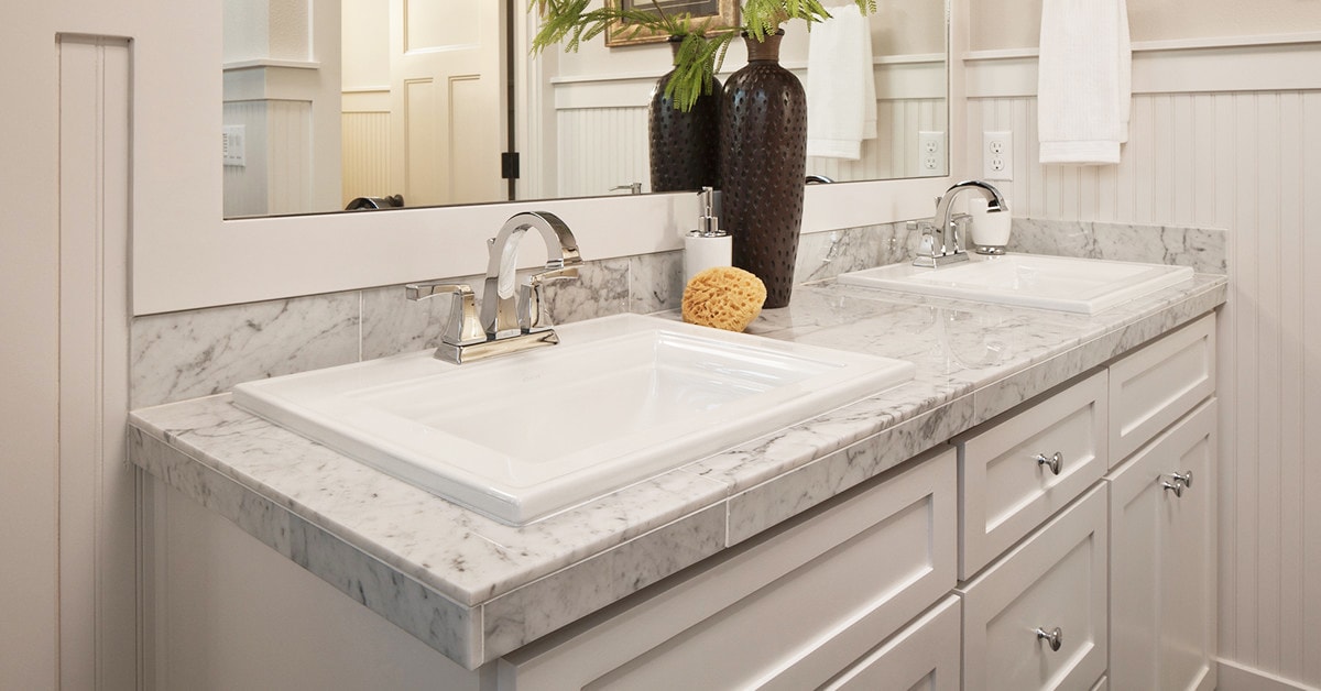 drop in bathroom sink with granite countertop