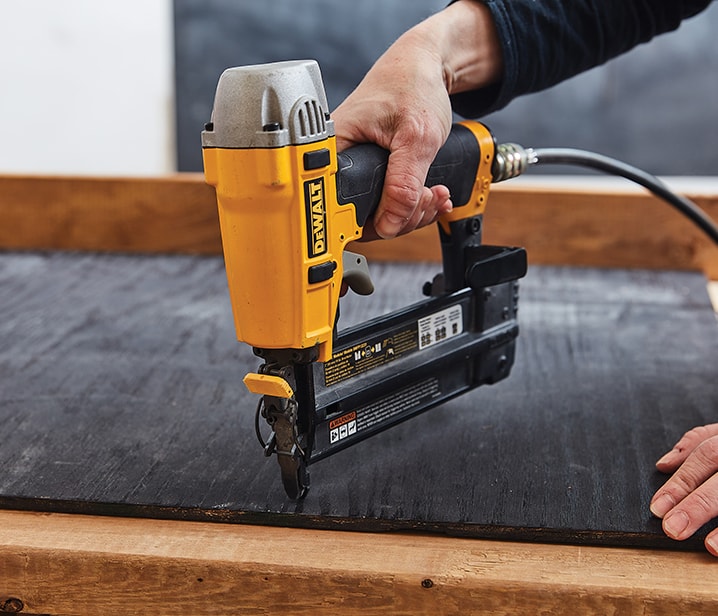 Woman using a nailer