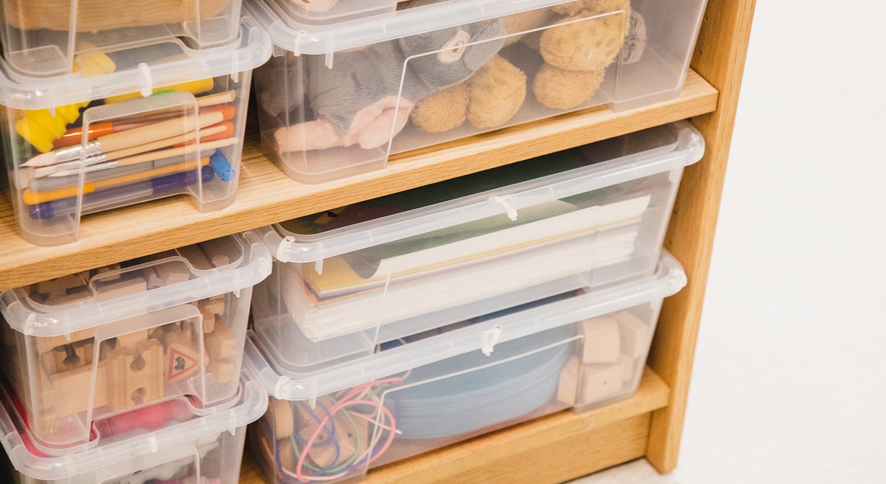 Toys in transparent plastic bins