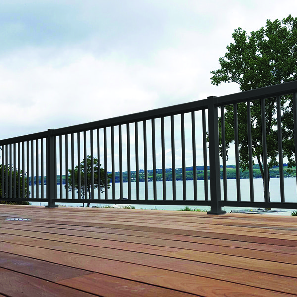 Black railings on a large wooden deck